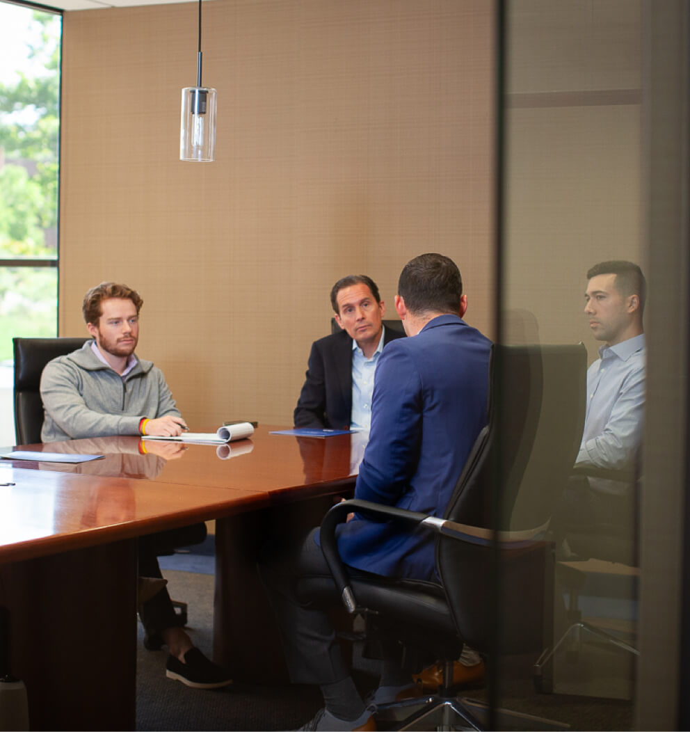 Photo of GVA advisors in a conference room