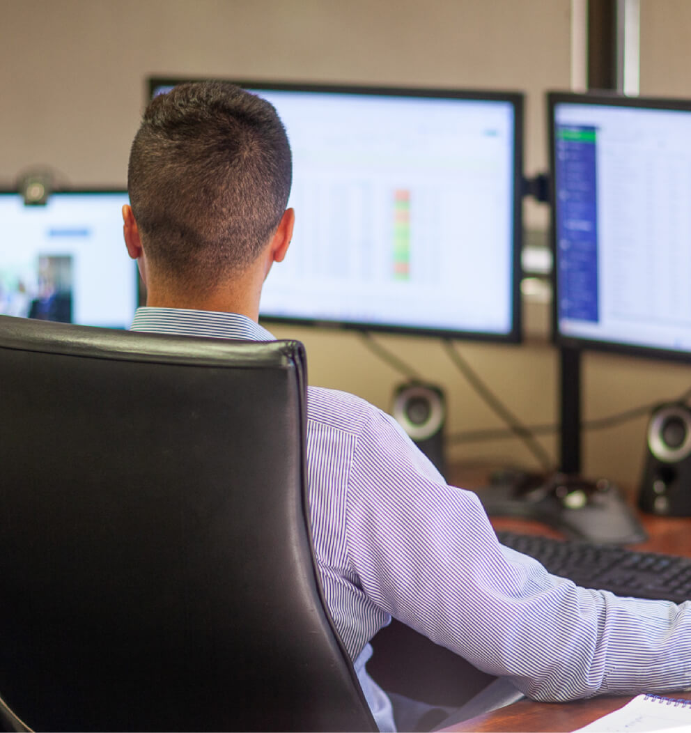 Photo of GVA advisor working at desk.